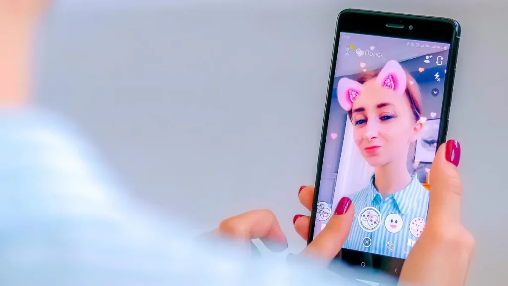 a girl applying a snapchat filter
