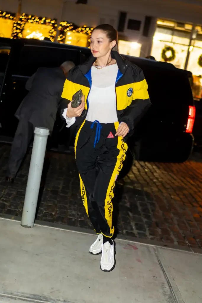 a girl wearing Tracksuit of black and yellow colour 